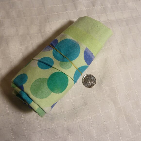 Fabric with an asymmetrical pattern of white, blue, and green bubbles - Picture 3 of 3